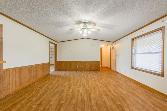 20 SE E Hwy, Trenton, MO 64683 - spare room with crown molding, light wood-style flooring, a wainscoted wall, and ceiling fan