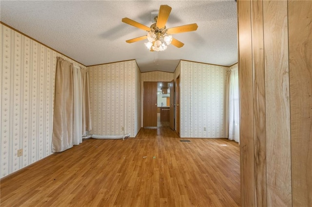 20 SE E Hwy, Trenton, MO 64683 - spare room featuring light wood-style flooring, a textured ceiling, and a ceiling fan