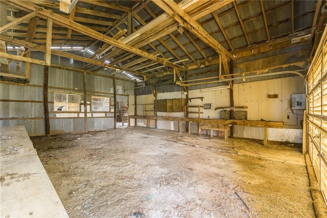 20 SE E Hwy, Trenton, MO 64683 - interior space featuring electric panel, high vaulted ceiling, and a garage
