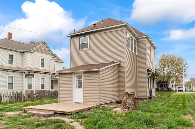 1404 Main St, Higginsville, MO 64037 - back of house featuring a deck