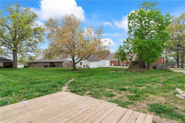 1404 Main St, Higginsville, MO 64037 - wooden terrace featuring a yard