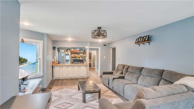 812 Pacific Ave, Osawatomie, KS 66064 - living room featuring light wood finished floors and baseboards