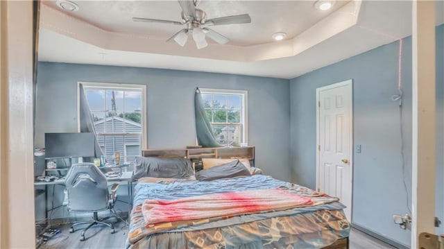 812 Pacific Ave, Osawatomie, KS 66064 - bedroom with a raised ceiling, wood finished floors, and a desk