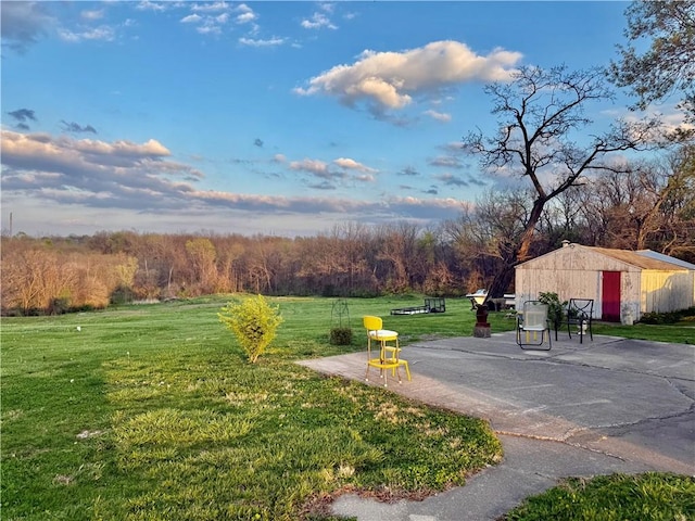 surrounding community featuring an outbuilding and a lawn