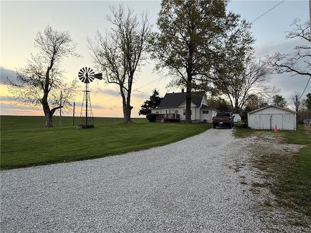 view of road featuring gravel driveway