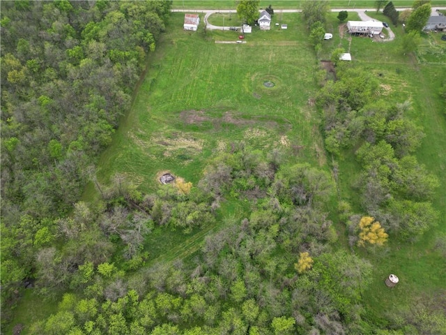 birds eye view of property with a rural view