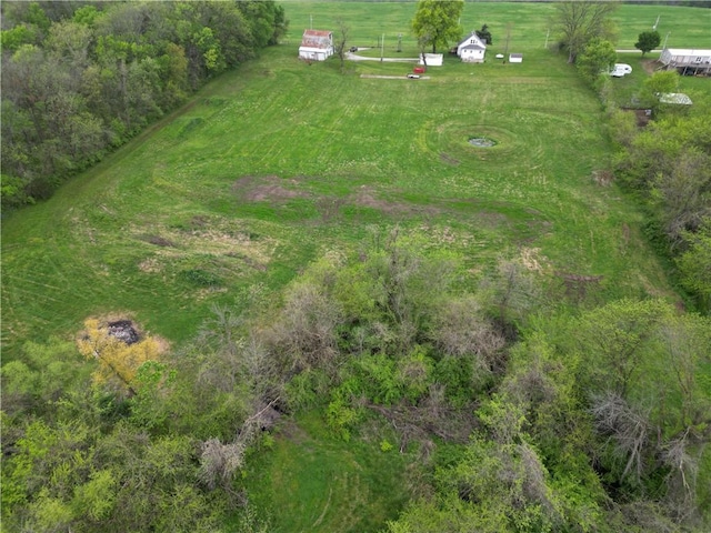 birds eye view of property with a rural view