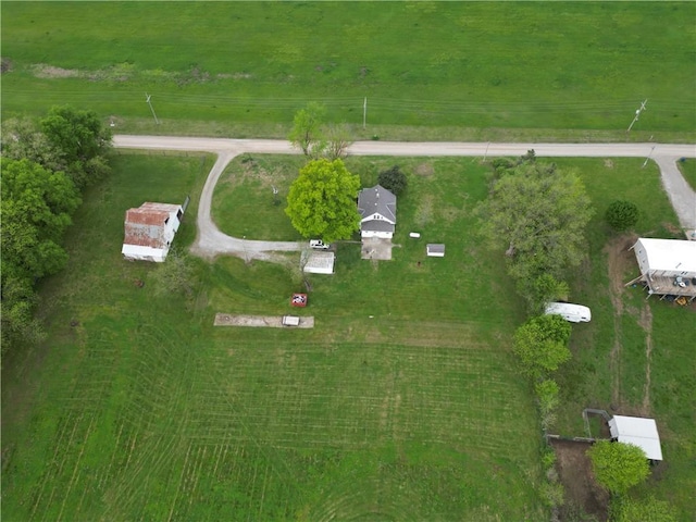 birds eye view of property featuring a rural view