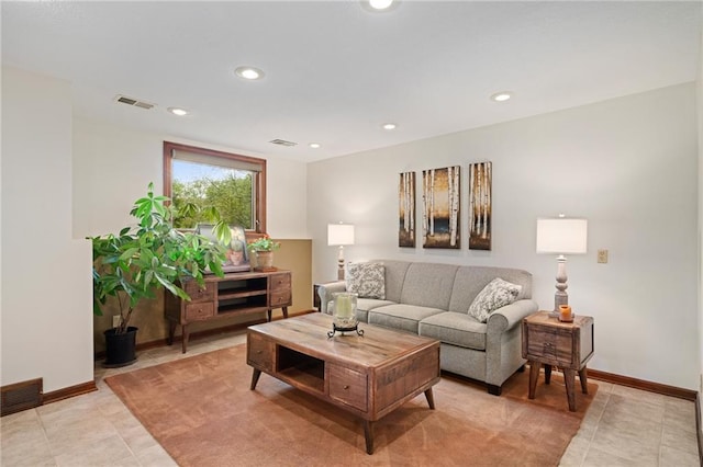 living room featuring recessed lighting, light tile patterned floors, and baseboards