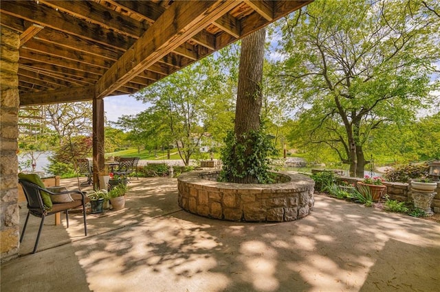 view of patio with view of wooded area