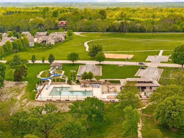 aerial view of a forest and a pool area
