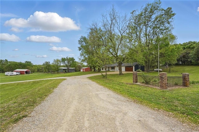 view of road with dirt driveway