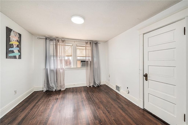 525 W 38th St, Kansas City, MO 64111 - empty room featuring baseboards, dark wood-style flooring, and cooling unit