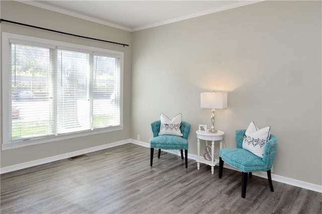 464 W 104th St Unit A, Kansas City, MO 64114 - sitting room with visible vents, baseboards, wood finished floors, and crown molding