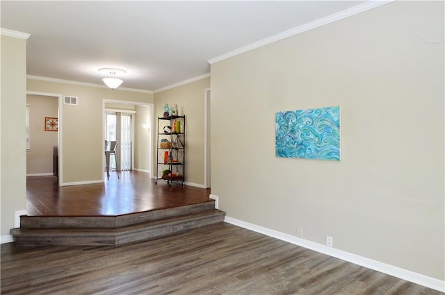464 W 104th St Unit A, Kansas City, MO 64114 - unfurnished room featuring visible vents, baseboards, wood finished floors, and ornamental molding