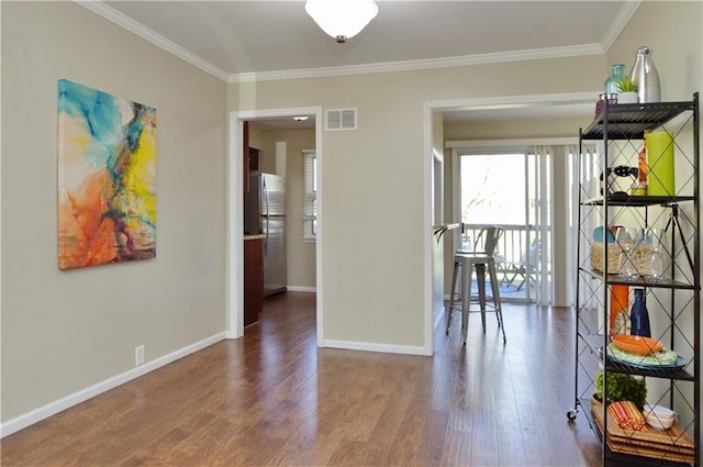 464 W 104th St Unit A, Kansas City, MO 64114 - interior space with wood finished floors, visible vents, crown molding, and baseboards