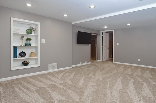 464 W 104th St Unit A, Kansas City, MO 64114 - empty room featuring baseboards, recessed lighting, visible vents, carpet, and built in shelves