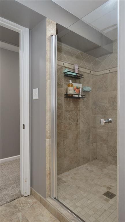 464 W 104th St Unit A, Kansas City, MO 64114 - bathroom featuring baseboards and a stall shower