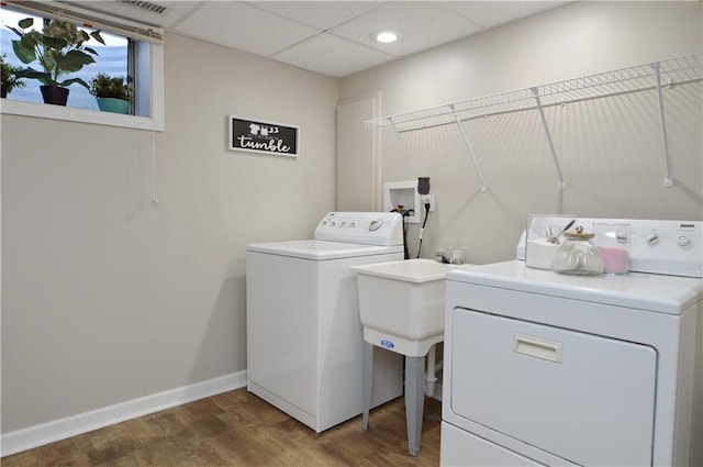 464 W 104th St Unit A, Kansas City, MO 64114 - washroom featuring recessed lighting, laundry area, wood finished floors, baseboards, and separate washer and dryer
