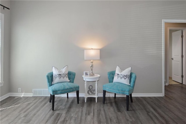 464 W 104th St Unit A, Kansas City, MO 64114 - sitting room with wood finished floors, visible vents, and baseboards