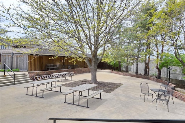 464 W 104th St Unit A, Kansas City, MO 64114 - view of property's community with a patio area and fence