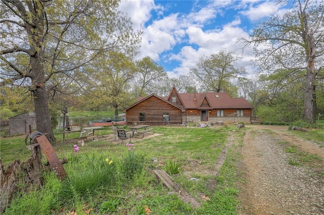 31025 203rd St, Leavenworth, KS 66048 - back of house with a fire pit and driveway