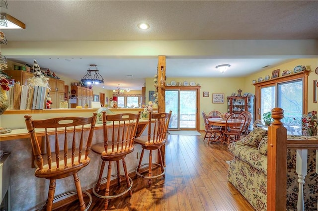 31025 203rd St, Leavenworth, KS 66048 - bar featuring recessed lighting, a wealth of natural light, and hardwood / wood-style floors