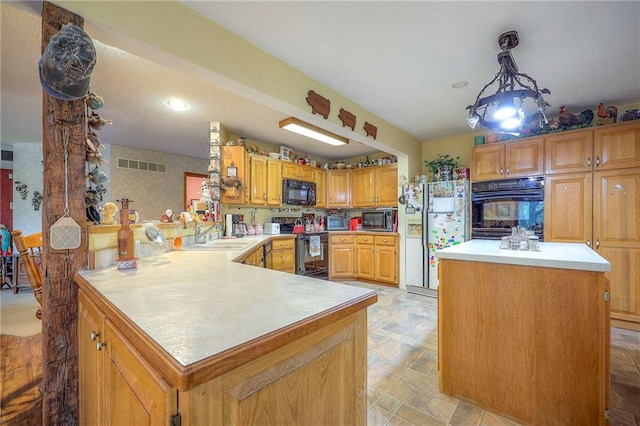 31025 203rd St, Leavenworth, KS 66048 - kitchen featuring visible vents, a peninsula, light countertops, a sink, and black appliances