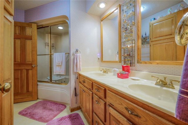 31025 203rd St, Leavenworth, KS 66048 - full bathroom featuring double vanity, a sink, bath / shower combo with glass door, and wallpapered walls