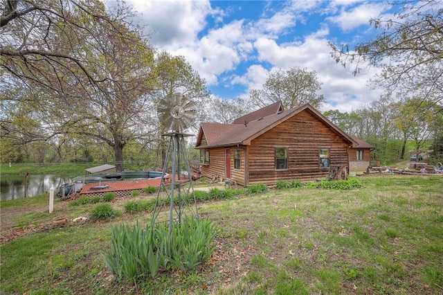 31025 203rd St, Leavenworth, KS 66048 - view of side of home featuring a lawn and a water view