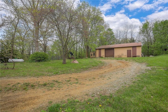 31025 203rd St, Leavenworth, KS 66048 - view of yard with a detached garage, a pole building, driveway, and an outbuilding