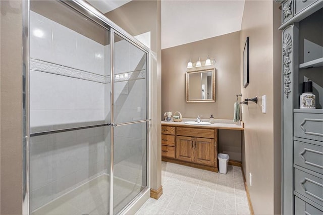 full bathroom featuring a shower stall, tile patterned flooring, and vanity