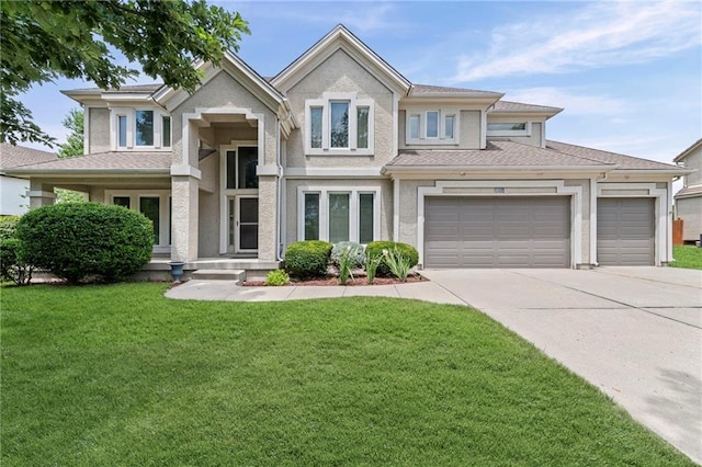5108 W 150th St, Leawood, KS 66224 - view of front of home featuring concrete driveway, a front yard, an attached garage, and stucco siding