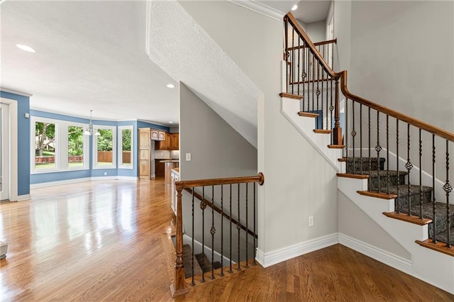 5108 W 150th St, Leawood, KS 66224 - stairway with wood finished floors and recessed lighting
