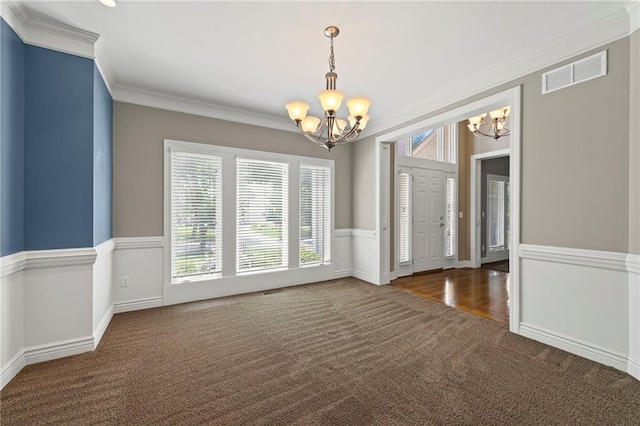5108 W 150th St, Leawood, KS 66224 - carpeted spare room featuring a chandelier and crown molding