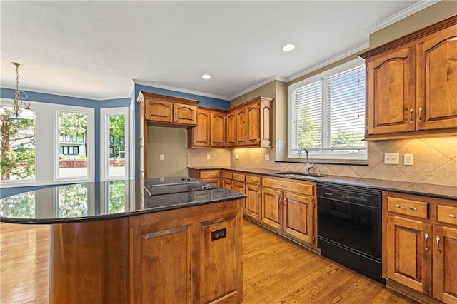 5108 W 150th St, Leawood, KS 66224 - kitchen featuring black appliances, healthy amount of natural light, brown cabinets, light wood-style floors, and ornamental molding