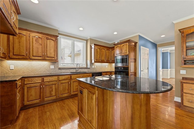 5108 W 150th St, Leawood, KS 66224 - kitchen featuring stainless steel microwave, oven, wood finished floors, brown cabinets, and recessed lighting