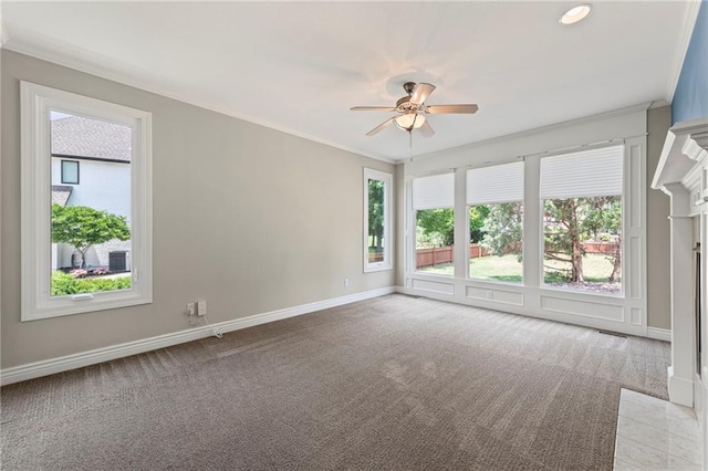 5108 W 150th St, Leawood, KS 66224 - empty room with healthy amount of natural light, a ceiling fan, light colored carpet, ornamental molding, and a fireplace with flush hearth