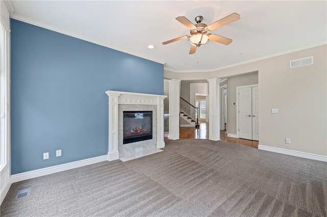 5108 W 150th St, Leawood, KS 66224 - unfurnished living room featuring ornate columns, carpet flooring, ceiling fan, crown molding, and a tiled fireplace