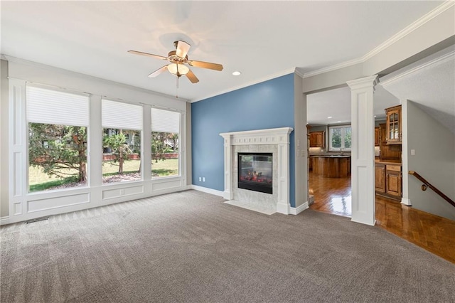 5108 W 150th St, Leawood, KS 66224 - unfurnished living room with carpet flooring, a ceiling fan, a tiled fireplace, crown molding, and recessed lighting