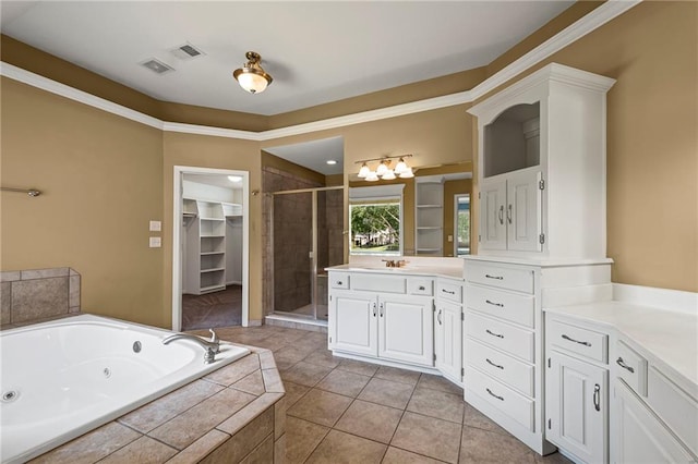 5108 W 150th St, Leawood, KS 66224 - bathroom with a stall shower, vanity, a tub with jets, tile patterned floors, and a walk in closet