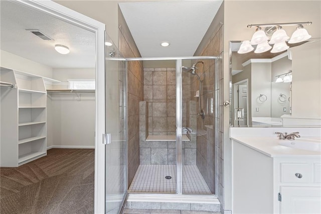 5108 W 150th St, Leawood, KS 66224 - bathroom with vanity, a walk in closet, a stall shower, and recessed lighting