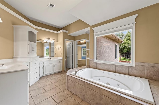 5108 W 150th St, Leawood, KS 66224 - bathroom with vanity, a whirlpool tub, tile patterned flooring, and crown molding