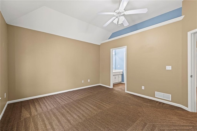 5108 W 150th St, Leawood, KS 66224 - unfurnished bedroom with vaulted ceiling, dark colored carpet, ensuite bathroom, and a ceiling fan