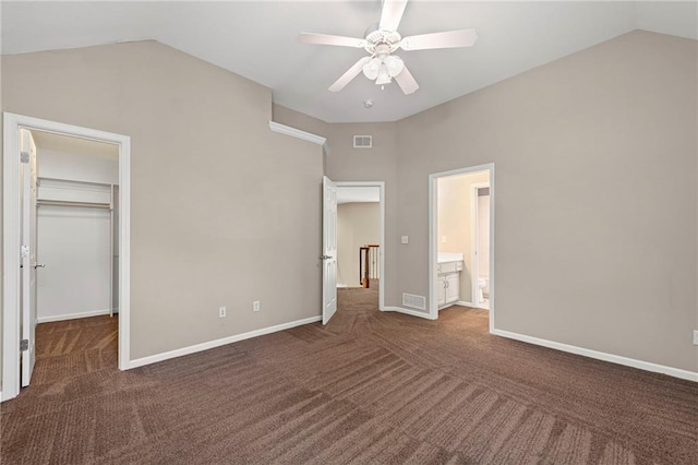 5108 W 150th St, Leawood, KS 66224 - unfurnished bedroom featuring carpet, lofted ceiling, a walk in closet, connected bathroom, and ceiling fan