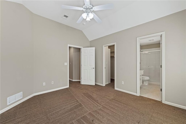 5108 W 150th St, Leawood, KS 66224 - unfurnished bedroom with carpet floors, vaulted ceiling, a walk in closet, connected bathroom, and ceiling fan