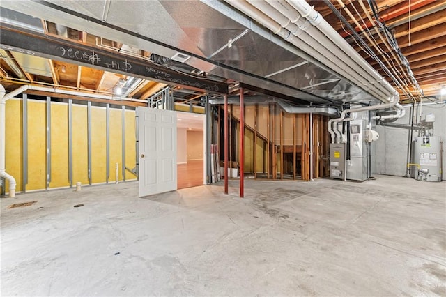 5108 W 150th St, Leawood, KS 66224 - unfinished basement featuring gas water heater and heating unit