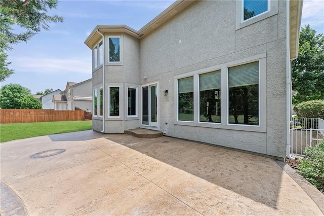 5108 W 150th St, Leawood, KS 66224 - back of property featuring stucco siding and a patio area