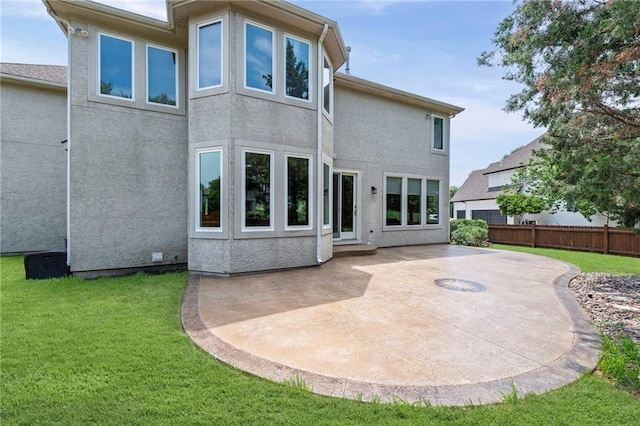5108 W 150th St, Leawood, KS 66224 - back of property with a patio area and stucco siding