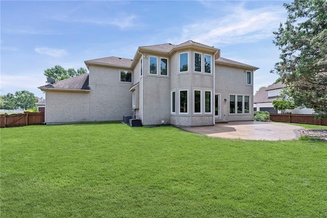 5108 W 150th St, Leawood, KS 66224 - back of house with a patio area and a fenced backyard